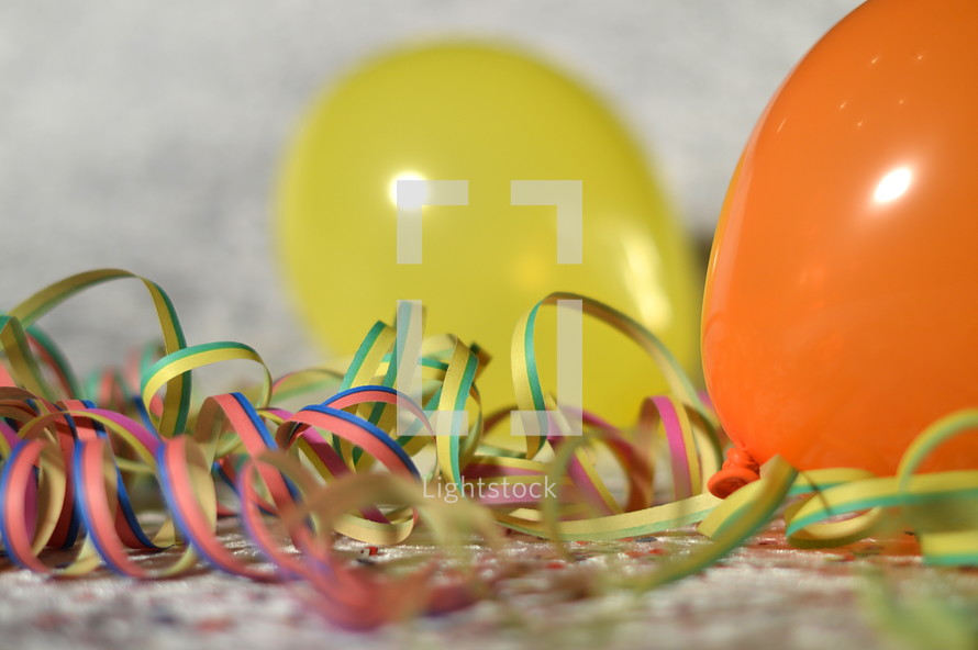 confetti, ribbons, and balloons 