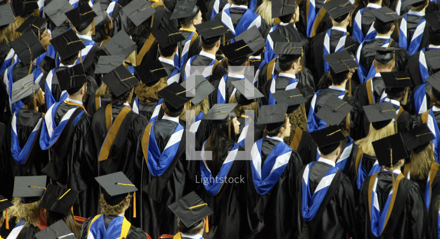 Graduates in rows graduation ceremony