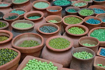 green beads in pottery jars 