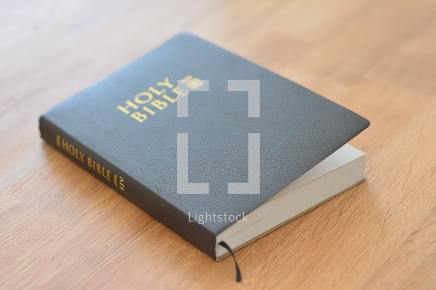 Holy Bible on a wood table 