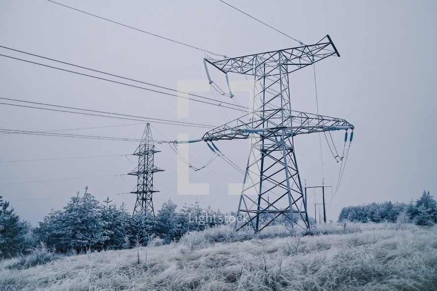 Electric voltage tower, power line, electricity pylon at winter snow background. High quality photo