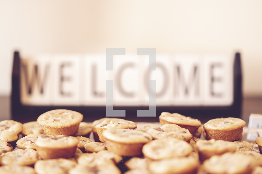 Welcome sign and muffins 