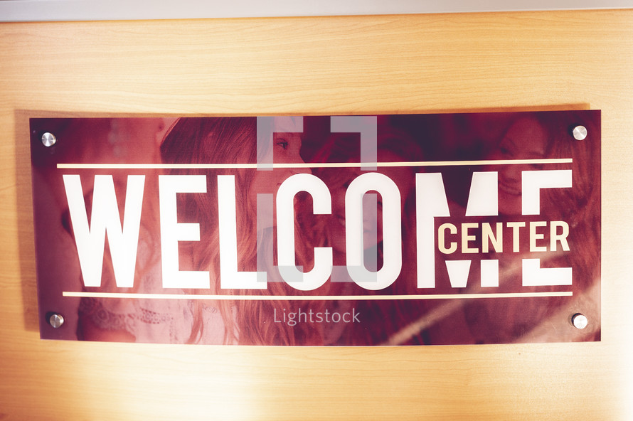 welcome center sign on a door 