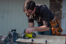 man using a table saw 