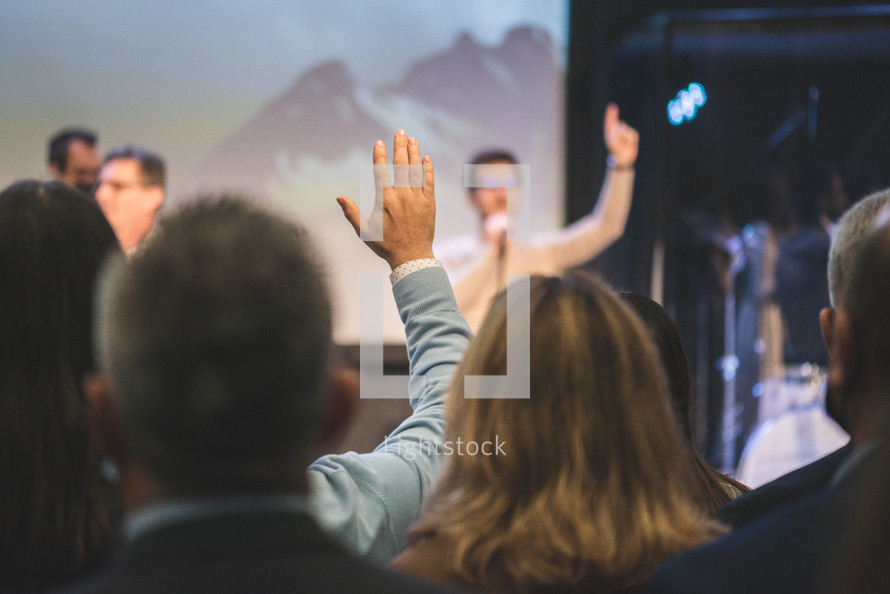 Church with hands raised in worship