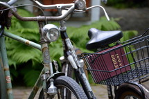 old bikes with a bible in the bicycle basket, 
