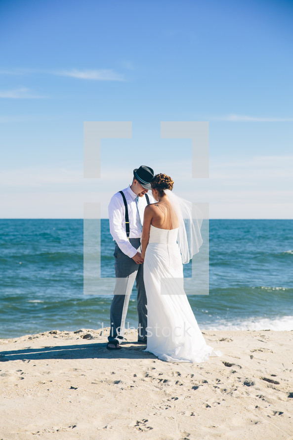 bride and groom on a beach 