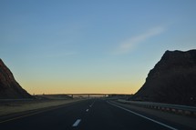 highway through a desert landscape 