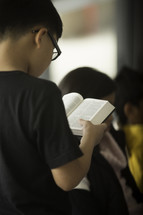 toddlers reading a Bible 