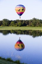 Hot air balloon over a lake.
