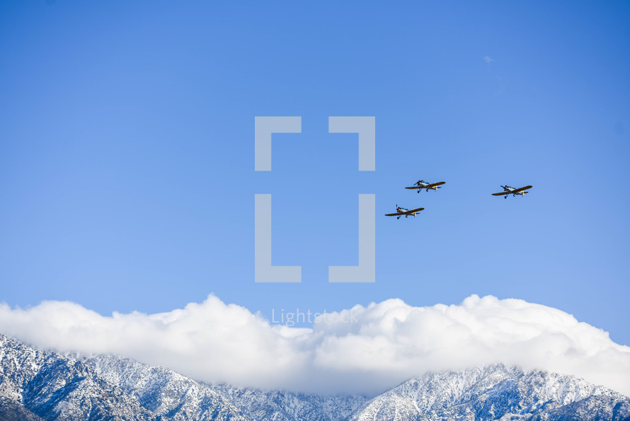 planes flying over mountains 