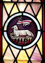 stained glass window of the lamb of God