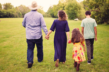 family walking outdoors together 