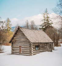 log cabin in snow 
