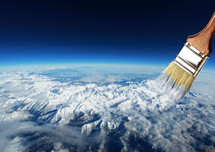paint brush over snow capped mountains 