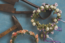 blacksmith tools and crowns of flowers 