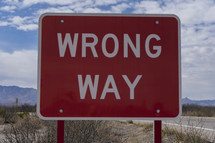 Close up of a Wrong Way sign