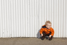 toddler boy squatting 