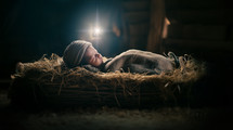 Baby Jesus in a manger. Nativity of Jesus. Christmas concept.