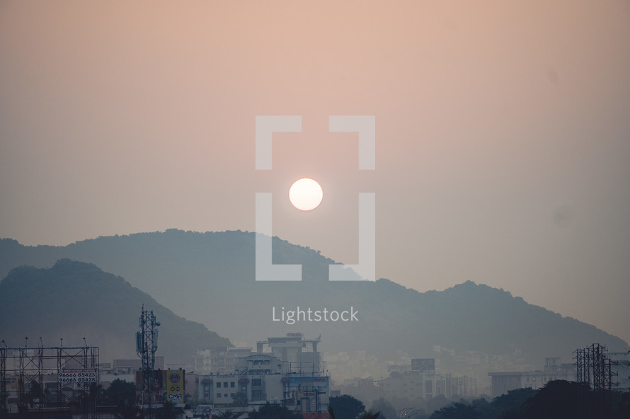 Sun rising over the city of Vizag Visakhapatnam on the Indian coast.