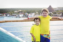 kids standing on a cruise ship deck 