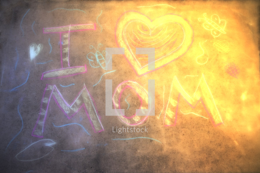 A photo of a young girls Mother's Day message in chalk on a driveway.