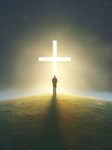 Conceptual image of a man standing in front of a cross. In his Light
