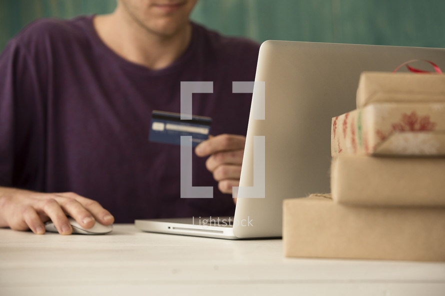 man shopping with a credit card online 