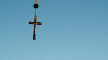 Silhouette of crucifix with sky background