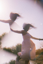 multiple exposure of a woman dancing outdoors 
