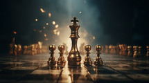 Gold chess pieces with a King and four pawns in the foreground. 