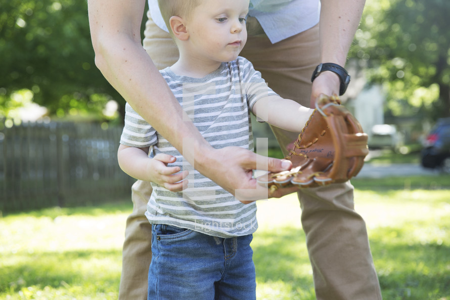 father and son throwing a baseball 