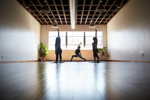 woman stretching in a yoga studio 