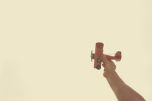 flying a toy airplane
