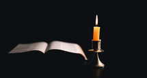 Bible and candlelight