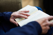 elderly man with a Bible in his lap 