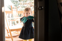 toddler girl cleaning a window 