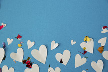border of paper hearts and confetti 