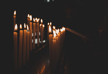 lighting candles in a church 