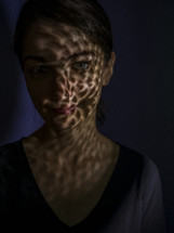 shadows on a woman's face 