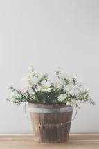 a wooden bucket for white daisies 