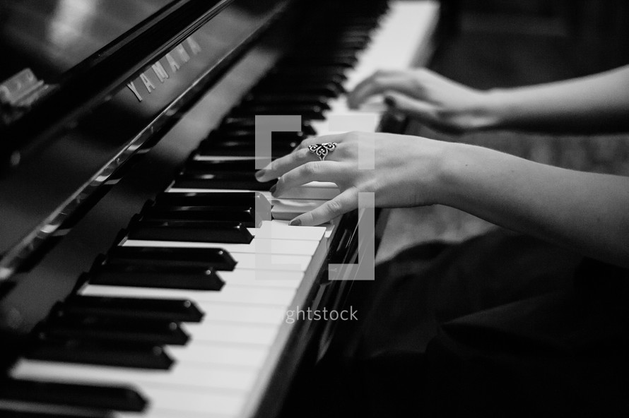 woman playing a piano 