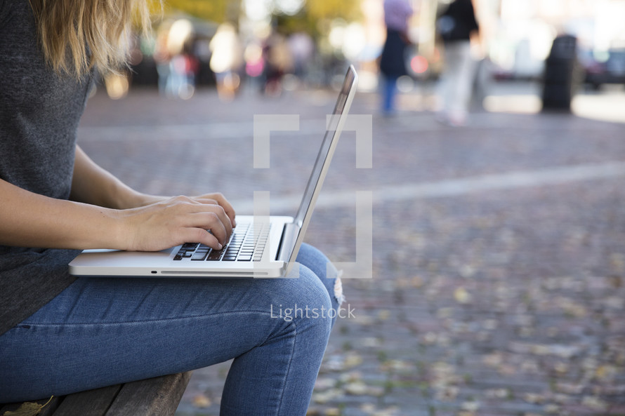 woman with a laptop on her lap 