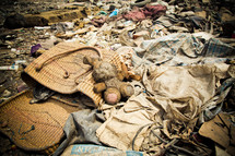 trash and belongings in a landfill 