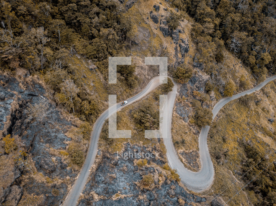 aerial view over a winding road 