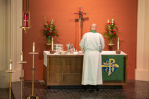 Pastor standing in front of the altar