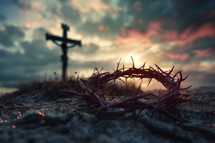 Crown of thorns laying before the cross