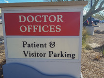 A doctor's office sign at a clinic