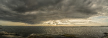 panoramic photo of a brewing storm rolling in over the coastline over the ocean in Gothenburg, Sweden.