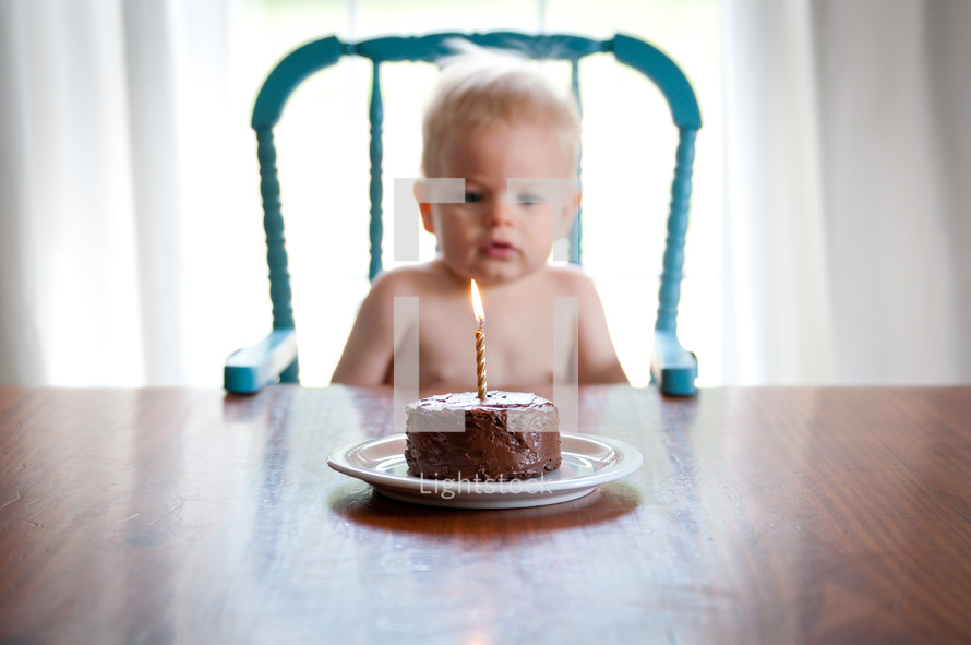 infant boy and birthday cake 